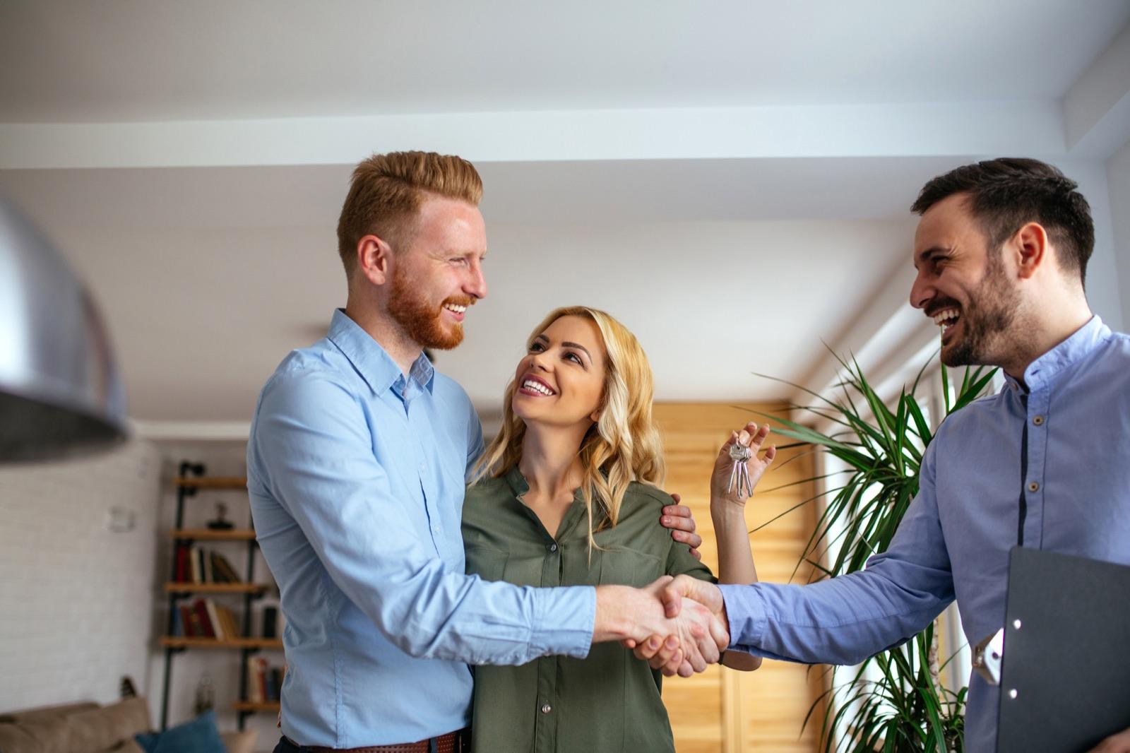 Real estate professionals shaking hands